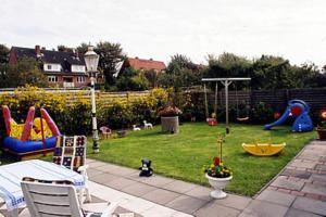a backyard with a play area with a playground at Badehausallee 20 Wohnung 1 in Cuxhaven