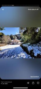 a television screen with a picture of a snow covered field at Raj Kot in Nainital
