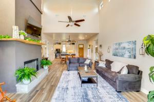 a living room with a couch and a fireplace at Luxe Waterfront Home with Boat Slip in New Braunfels in Schumannsville