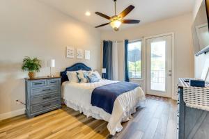 a bedroom with a bed and a ceiling fan at Luxe Waterfront Home with Boat Slip in New Braunfels in Schumannsville
