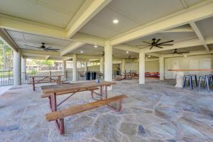a large room with tables and stools in it at Luxe Waterfront Home with Boat Slip in New Braunfels in Schumannsville