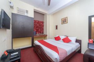 Ένα ή περισσότερα κρεβάτια σε δωμάτιο στο Hotel O B Square Homes