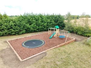 an aerial view of a play area with a playground at The Oak, Country Home, Sleeps 4 with Hot Tub near Durham City & Bishop Auckland in Durham