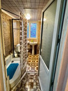 a bathroom with a shower and a tub and a sink at Casa Beijing in Braşov