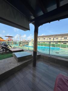 a view of a swimming pool from the roof of a building at Pousada Pampulha in Salinópolis