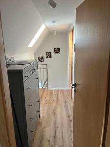 an empty kitchen with a counter and a door at Ferienhaus Salz & Seele in Husum