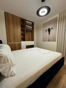 Giường trong phòng chung tại Shëngjin Shores Apartments