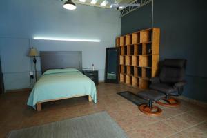 Ένα ή περισσότερα κρεβάτια σε δωμάτιο στο Loft Casa Itayata