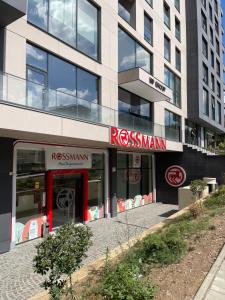 a building with a red sign in front of it at City View Prishtina in Pristina +5 photos