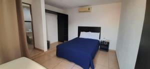 Ένα ή περισσότερα κρεβάτια σε δωμάτιο στο Hotel DI-AN