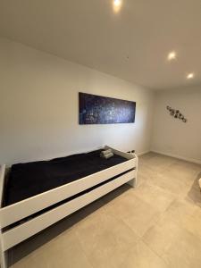 En eller flere senge i et værelse på Villa Eco Chic