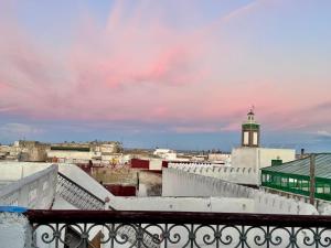 a view from the roof of a building with a clock tower at Hotel Riad Dalia Tetouan in Tetouan
