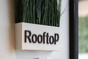 a sign on a door with a plant at Zielo Rentals Palma ,Private balcony, Rooftop Walk to Zocalo in Mexico City