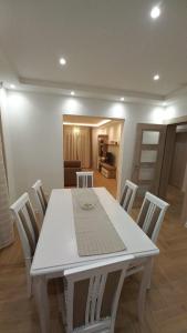 a white table and chairs in a living room at La Terrazza in Tivat