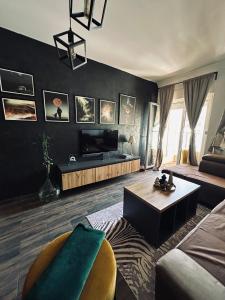 a living room with a couch and a table at Apartman Viktorija in Žabljak