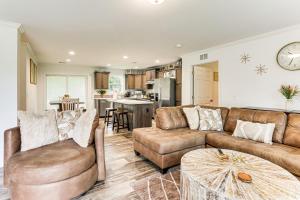 a living room with a couch and a table at Dog Friendly, Screened Porch St Stephen Retreat! in Saint Stephen