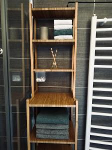 a wooden towel rack with towels in a bathroom at Vila Gorska in Žabljak +37 photos