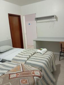 Ένα ή περισσότερα κρεβάτια σε δωμάτιο στο Pousada & Hospedaria Monte Tabor +1 φωτογραφίες