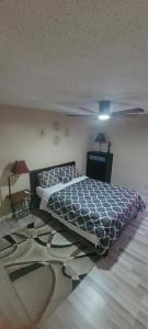 Ένα ή περισσότερα κρεβάτια σε δωμάτιο στο Cozy Condo2