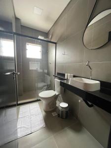 a bathroom with a toilet and a sink and a shower at Hs Hotel Morumbi in São Paulo +20 photos