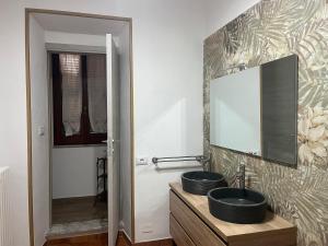 a bathroom with a sink and a mirror at Casa sulla Rocca in Rocca di Papa +10 photos