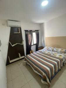 Postel nebo postele na pokoji v ubytování Departamentos frente al shopping