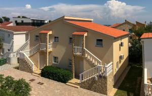 a large house with stairs in a city at 2 Bedroom Amazing Apartment In Vir in Vir