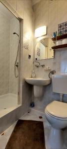 a bathroom with a toilet and a sink and a shower at Willa Szymusiowa Szczyrk Pokoje i Apartamenty Przy Gondoli in Szczyrk