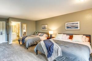 a bedroom with two beds and a bathroom at Margaritaville Lake Resort Home 1 Mi to Marina! in Damsel +31 photos
