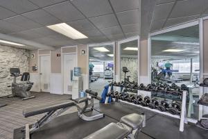 a gym with several treadmills and machines at Margaritaville Lake Resort Home 1 Mi to Marina! in Damsel