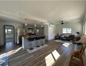 an open living room with a kitchen and a living room at Ashland Bungalow downtown in Ashland +6 photos