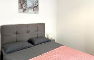 a bed with a headboard in a bedroom at 1 Bedroom Lovely Apartment In Krusevo in Kruševo