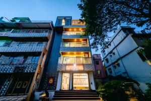 a tall building with stairs leading up to it at Livotel Premium Hotel in Bhubaneshwar
