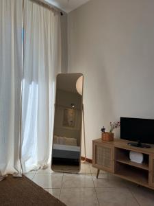 Un televizor și/sau centru de divertisment la Casa AM - Apartment B&B Molfetta