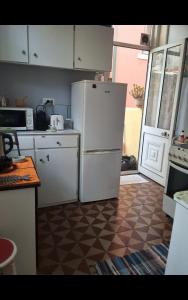 Η κουζίνα ή μικρή κουζίνα στο Quarto acomodação Porto