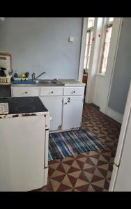 Η κουζίνα ή μικρή κουζίνα στο Quarto acomodação Porto +1 φωτογραφίες