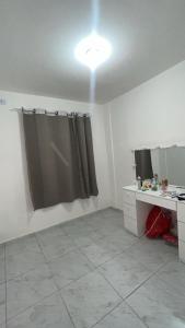a bathroom with a shower curtain in a room at Apto próx a PRAIA in Paulista +6 photos
