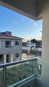 a view of a building from a balcony at Apto próx a PRAIA in Paulista