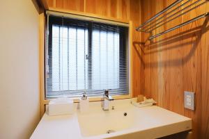 a bathroom with a white sink and a window at Potsupotsuan - Vacation STAY 20035 in Ise +5 photos