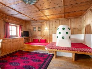a living room with a couch and a chair at Schweizerhof Margrith in Huben