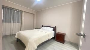 Ένα ή περισσότερα κρεβάτια σε δωμάτιο στο Tu estancia perfecta