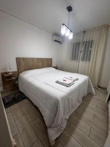 Ένα ή περισσότερα κρεβάτια σε δωμάτιο στο Espacio Casa Ser - Cochera incluida