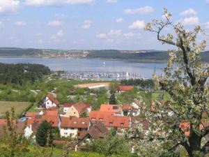 a town with a body of water and a city at Holiday apartment in Ramsberg
