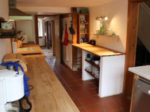 a kitchen with a counter and a tile floor at Holiday home with 4 bedrooms in Maroldsweisach +33 photos