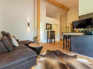 a living room with a couch and a table at One-bedroom apartment in Kalzhofen