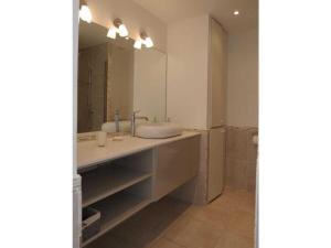 a bathroom with a sink and a mirror at Apartment Splendid Azur in Sainte-Maxime +17 photos