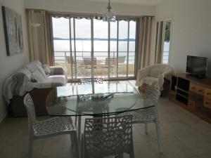 a living room with a glass table and chairs at Apartment Splendid Azur in Sainte-Maxime