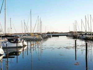 a bunch of boats are docked in a marina at in Fischers Hus in Stenderup