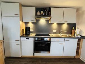 Η κουζίνα ή μικρή κουζίνα στο Holiday apartment Zum Torfstecher +22 φωτογραφίες