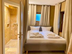 a bedroom with a bed with a shower and a shower at Experience luxury in Mollenberg in Mollenberg